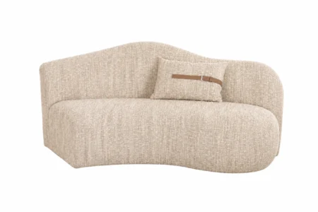 Sharelle Melano Curved Sectional Sofa upholstered in textured bouclé fabric in a modern living room.
