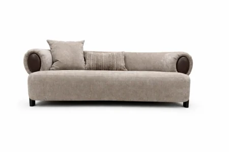 Sharelle Arden sofa upholstered in taupe fabric with contemporary rolled arms and accent pillows.